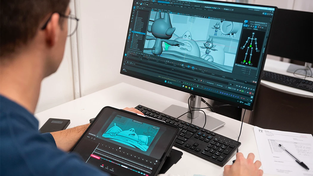 alessandro contenta fa delle animazioni 3d al computer.